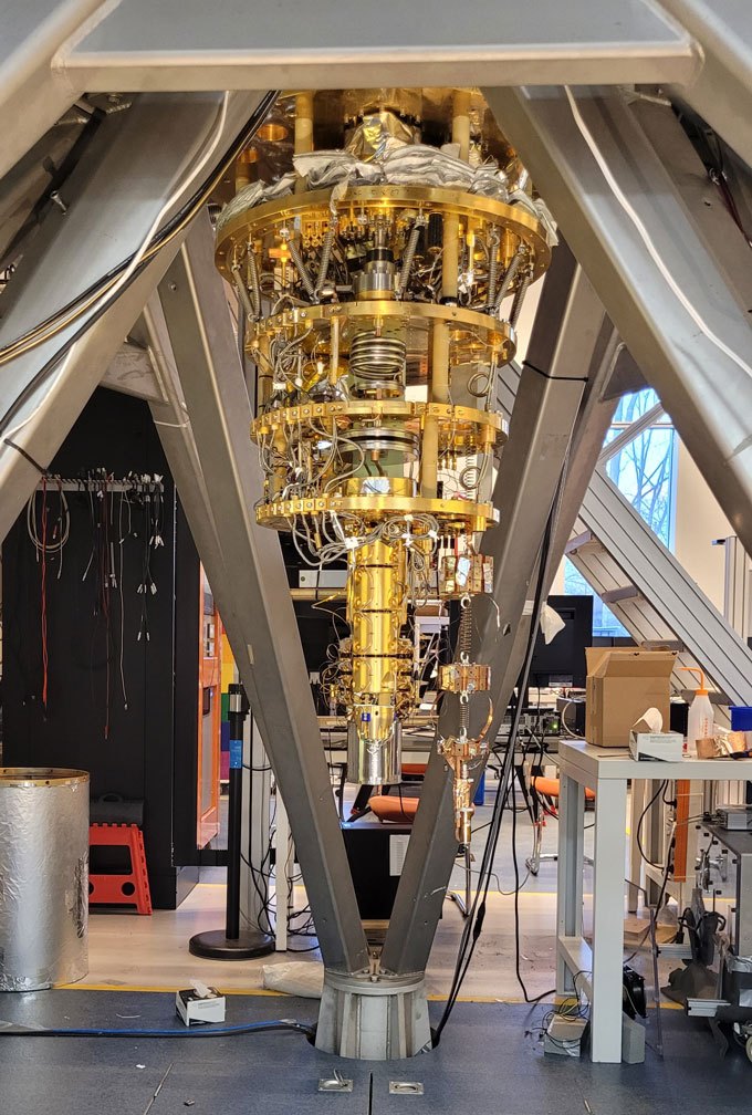 An apparatus resembling a gold chandelier in a laboratory setup, designed to detect magnetic disturbances caused by dark matter